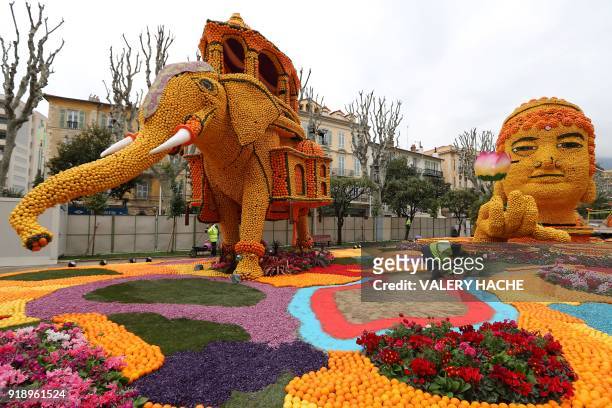 People landscape the area where sculptures made of lemons and oranges are displayed, on the eve of the 85th Lemon Festival, on February 16, 2018 in...
