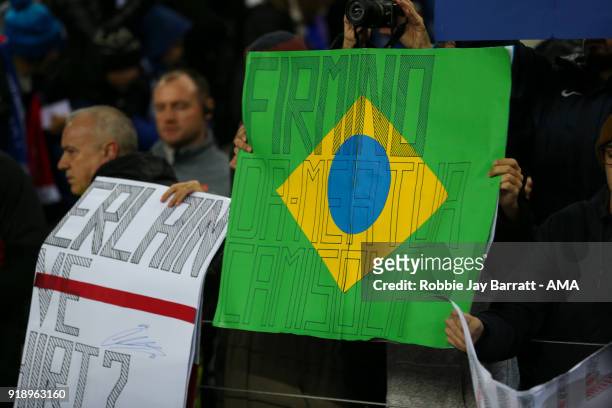 Fan of FC porto holds up a banner for Roberto Firmino of Liverpool during the UEFA Champions League Round of 16 First Leg match between FC Porto and...