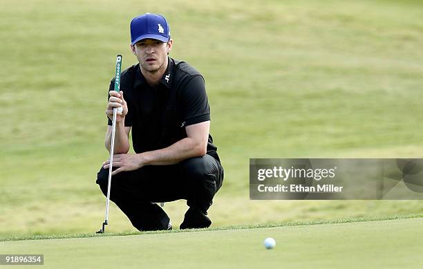 Singer Justin Timberlake watches another player's ball roll by on the 8th hole green during the Justin Timberlake Shriners Hospitals for Children...