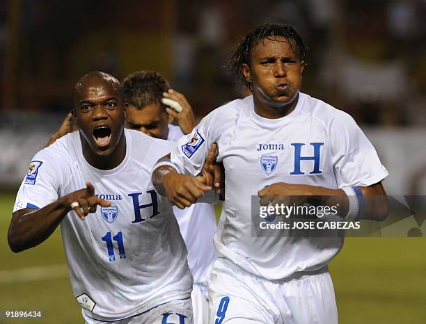 Hondurans players David Suazo and Carlos Pavon celebrate their goal against El Salvador at the Cuscatlan Stadium in San Salvador, El Salvador for the...