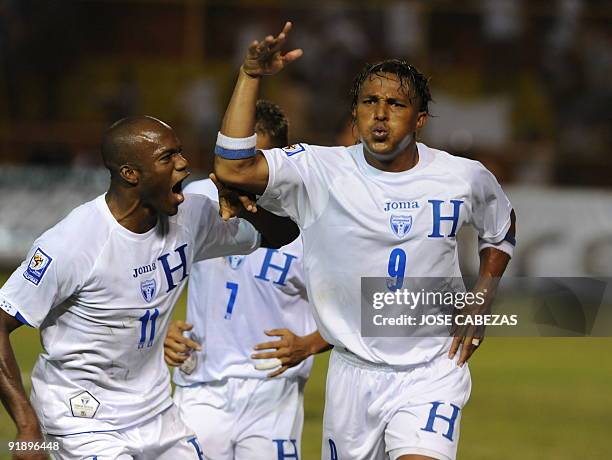 Hondurans players David Suazo and Carlos Pavon celebrate their goal against El Salvador at the Cuscatlan Stadium in San Salvador, El Salvador for the...