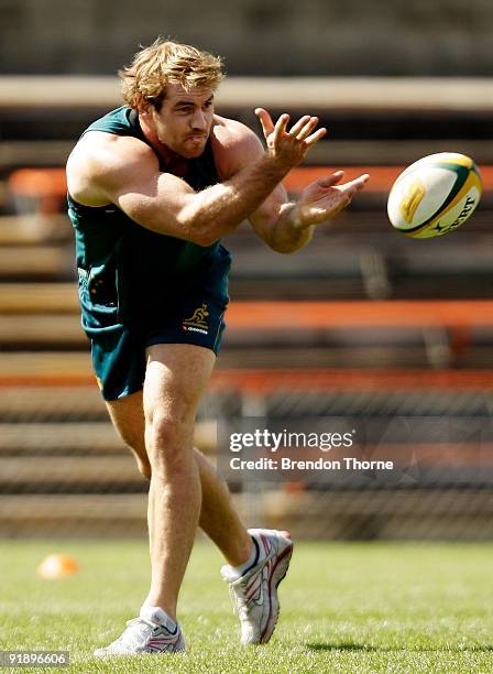 Rocky Elsom of the Wallabies passes during an Australian Wallabies training session at Leichhardt Oval on October 15, 2009 in Sydney, Australia.