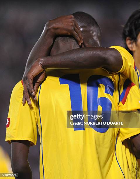 Colombia's Adrian Ramos celebrates with a teammate after scoring against Paraguay during their FIFA World Cup South Africa 2010 football qualifier at...