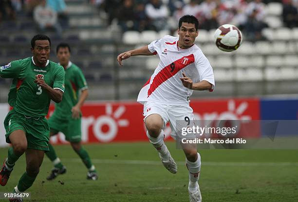 Hernan Rengifo of Peru vies for the ball with Edemir Rodriguez of Bolivia during their FIFA World Cup 2010 qualifier at Alejandro Villanueva Stadium...