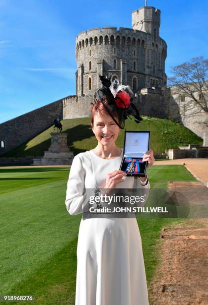 Britain's first astronaut Helen Sharman holds her Companion of the Order of St Michael and St George medal presented by Queen Elizabeth II for...