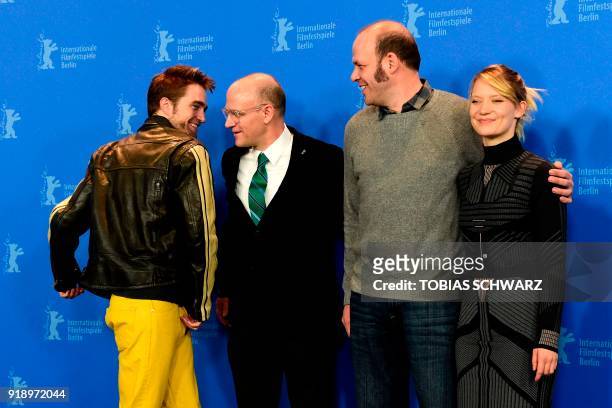 Directors and screenwriters Nathan Zellner and David Zellner pose with British actor Robert Pattinson and Australian actress of Polish origin Mia...