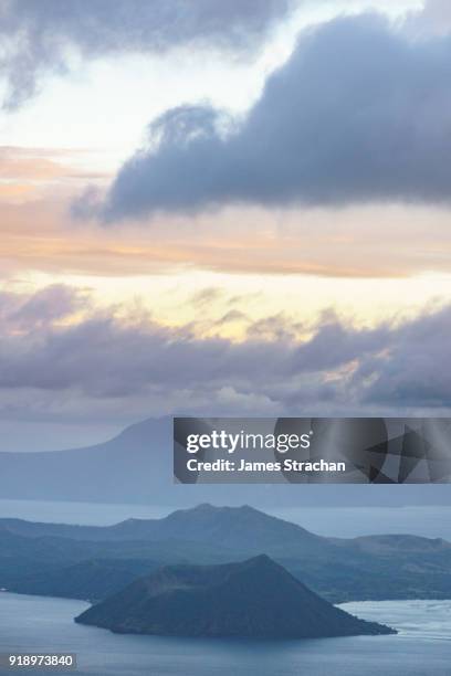 active taal volcano at dusk in the middle of lake taal, itself the result of eruptions over 100,000 years ago, tagaytay, luzon island, philippines - taal 個照片及圖片檔