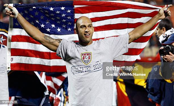 Goalkeeper Tim Howard celebrates with teammates after the U.S. Tied the score in the final minute against Costa Rica in their FIFA 2010 World Cup...