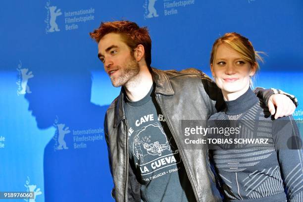 British actor Robert Pattinson and Australian actress of Polish origin Mia Wasikowska pose during a photocall before a press conference to present...