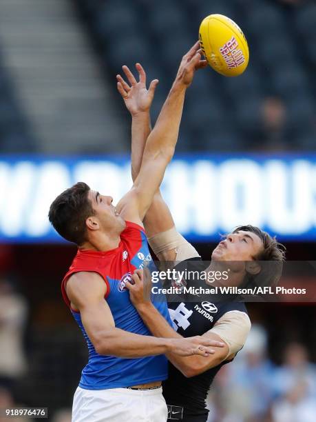 Christian Petracca of the Demons and Caleb Marchbank of the Blues compete in a ruck contest during the AFLX match between the Melbourne Demons and...