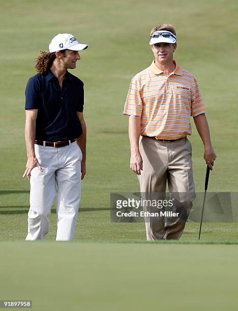 Saxophonist Kenny G and golfer David Toms walk toward the 8th green during the Justin Timberlake Shriners Hospitals for Children Open Championship...