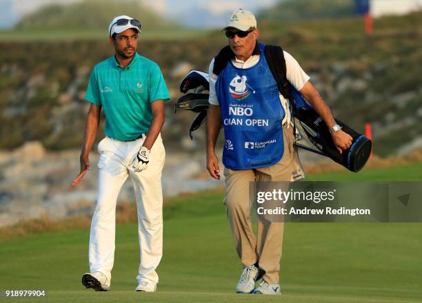 Azaan Al Rumhy of the Oman and his caddie Dr Mohammed bin Hamad Al lRuhmy on the par four 18th hole during the second round of the NBO Oman Open at...