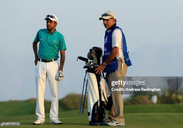 Azaan Al Rumhy of the Oman and his caddie Dr Mohammed bin Hamad Al lRuhmy on the par four 18th hole during the second round of the NBO Oman Open at...