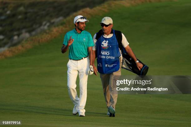 Azaan Al Rumhy of the Oman and his caddie Dr Mohammed bin Hamad Al lRuhmy on the par four 18th hole during the second round of the NBO Oman Open at...