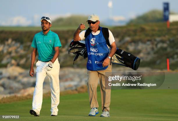 Azaan Al Rumhy of the Oman and his caddie Dr Mohammed bin Hamad Al lRuhmy on the par four 18th hole during the second round of the NBO Oman Open at...