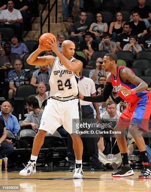 Richard Jefferson of the San Antonio Spurs looks to pass against Rasual Butler of the Los Angeles Clippers on October 14, 2009 at the AT&T Center in...