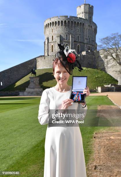 Britain's first astronaut Helen Sharman holds her Companion of the Order of St Michael and St George medal that was presented to her by Queen...