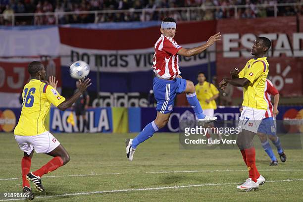Gustavo Adrian Ramos of Colombia vies for the ball with players during their match as part of the 2010 FIFA World Cup Qualifier at Defensores del...