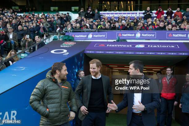 Prince Harry with Jonny Wilkinson and Ben Calveley, RFU head of Strategy and Corporate affairs, as he attends the England rugby team's open training...