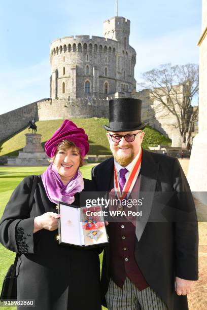 Co-founder of the Ambassador Theatre Group Limited, Rosemary Squire, accompanied by her husband Sir Howard Panter, with her Dame Commander medal that...