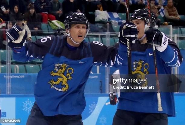 Veli-Matti Savinainen of Finland celebrates after scoring against Lars Haugen of Norway in the third period during the Men's Ice Hockey Preliminary...