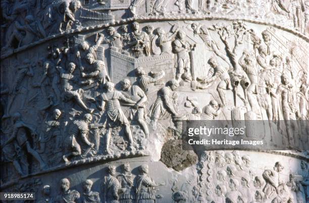 Roman soldiers building a fort in the Dacian campaign, Trajan's Column, Rome, c2nd century. Triumphal column in Rome, Italy, commemorating Roman...