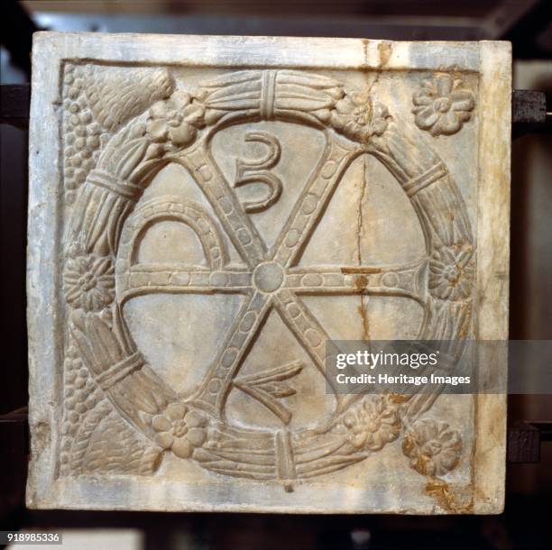Chi-Ro symbol with Alpha and Omega, Early Christian Sarcophagus, Rome, 4th century. The Chi Rho is one of the earliest forms of christogram, formed...