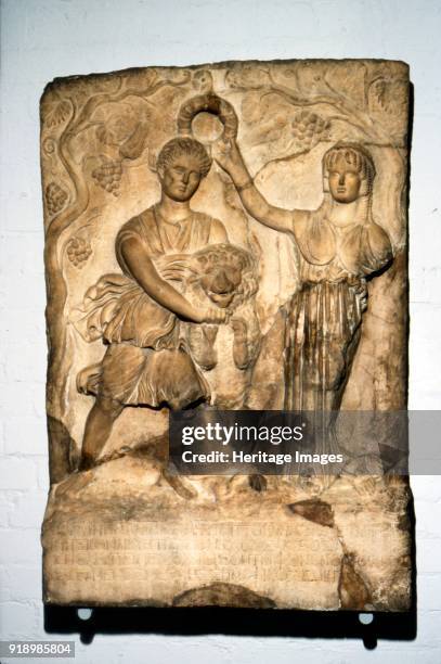 Cyrene crowned by Libya, c120-140. Marble inscribed relief of the nymph Cyrene, overpowering a lion, and being crowned by Libya. At British Museum....