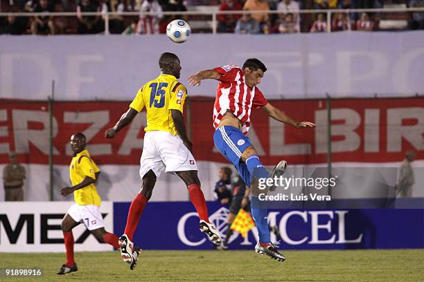 Oscar Cardozo of Paraguay vies for the ball with Cristian Zapata of Colombia during their match as part of the 2010 FIFA World Cup Qualifier at...