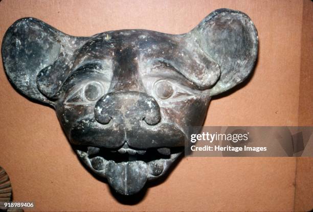 Pottery Mask of a Bat, grey with red and white paint, Zapotec, Mexico, 300-900. The Zapotec civilization was an indigenous pre-Columbian civilization...