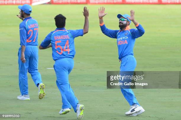 Shardul Thakur and Virat Kohli of India celebrate the wicket of Farhaan Behardien of the Proteas during the 6th Momentum ODI match between South...