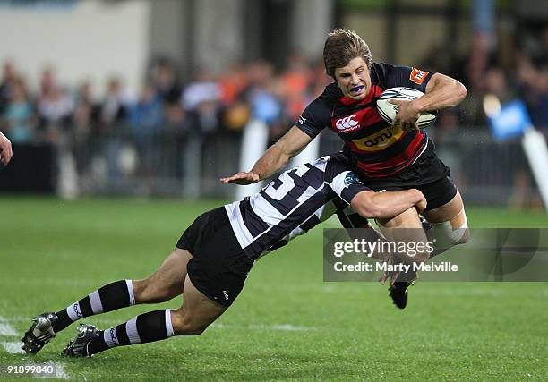 James Paterson of Canterbury gets tackled by Israel Dagg of Hawks Bay during the Air New Zealand Cup match between the Hawkes Bay Magpies and...