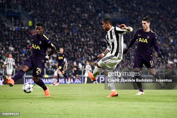 Serge Aurier and Douglas Costa during the UEFA Champions League Round of 16 First Leg match between Juventus and Tottenham Hotspur at Allianz Stadium...