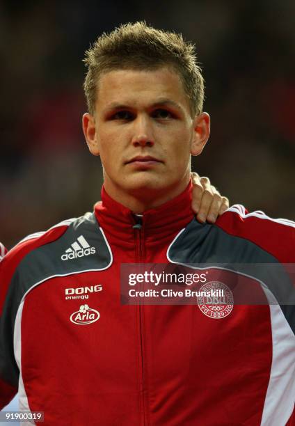 Michael Jacobsen of Denmark stands for the national anthem during the FIFA 2010 group one World Cup Qualifying match between Denmark and Hungary at...