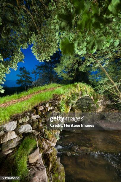 Medieval packhorse bridge, Fawcett Mill Fields, Gaisgill, Tebay, Cumbria, circa 2016. View looking scross the bridge downstream from the south-east.