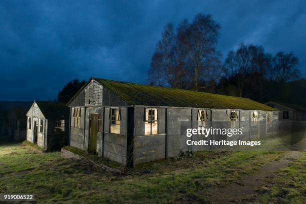 Harperley Prisoner of War Camp 93, Craigside, County Durham, circa 2012. Exterior of one of the huts, lit from within. The camp was built by Italian...