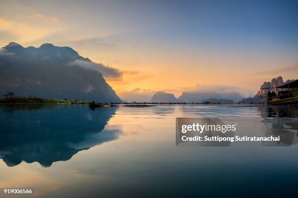 beautiful morning of mountains lake river sky and natural attractions in ratchaprapha dam at khao sok national park, surat thani province, thailand. - surat thani province stock-fotos und bilder