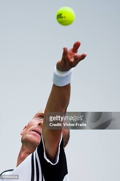 Nikolay Davydenko of Russia serves to Fernando Gonzalez of Chile during day five of 2009 Shanghai ATP Masters 1000 at Qi Zhong Tennis Centre on...