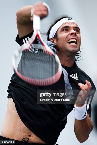 Fernando Gonzalez of Chile returns a shot to Nikolay Davydenko of Russia during day five of 2009 Shanghai ATP Masters 1000 at Qi Zhong Tennis Centre...