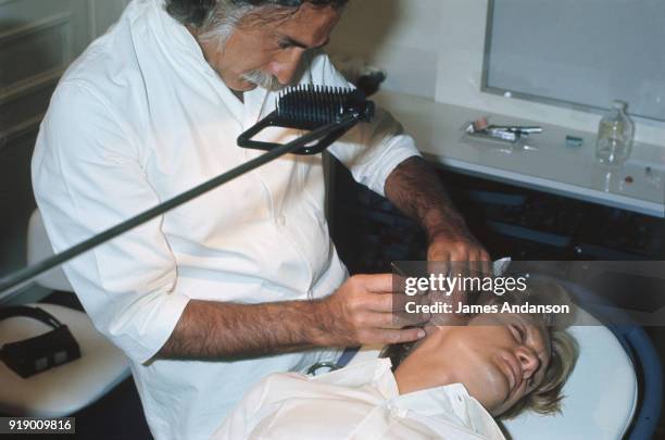 Paris - Claude François gets surgery on the 2 eardrums following the bombing in the Hilton hotel in London