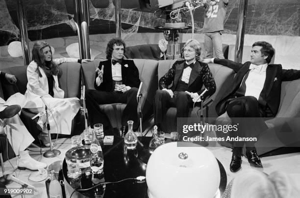 Paris - from left to right : French singers Sheila, Michel Sardou and Claude François with the actor Jean-Claude Brialy on the set of the french tv...