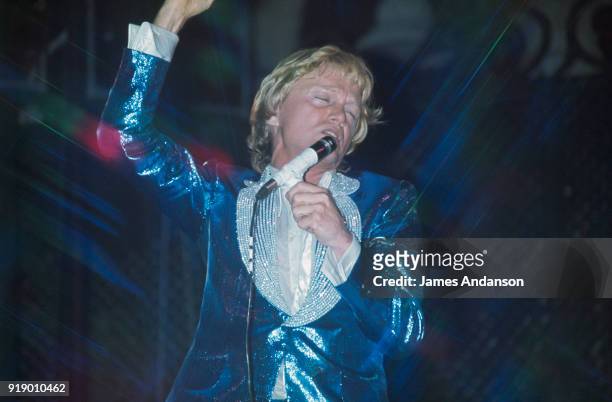 French singer Claude François performing on stage