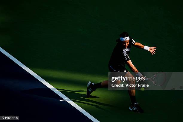 Fernando Gonzalez of Chile returns a shot to Nikolay Davydenko of Russia during day five of 2009 Shanghai ATP Masters 1000 at Qi Zhong Tennis Centre...