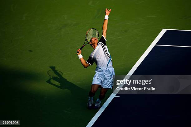 Nikolay Davydenko of Russia serves to Fernando Gonzalez of Chile during day five of 2009 Shanghai ATP Masters 1000 at Qi Zhong Tennis Centre on...