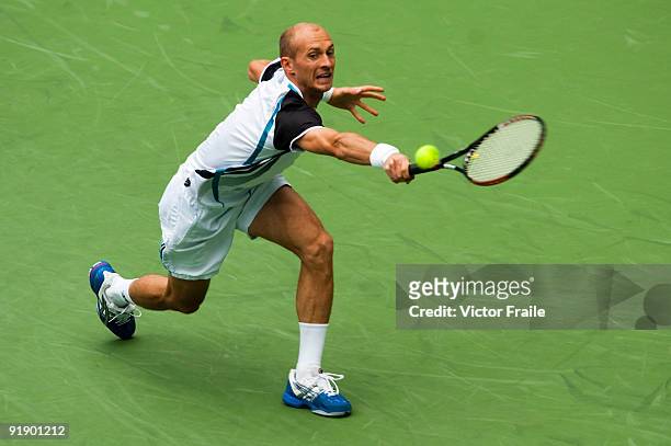 Nikolay Davydenko of Russia returns a shot to Fernando Gonzalez of Chile during day five of 2009 Shanghai ATP Masters 1000 at Qi Zhong Tennis Centre...