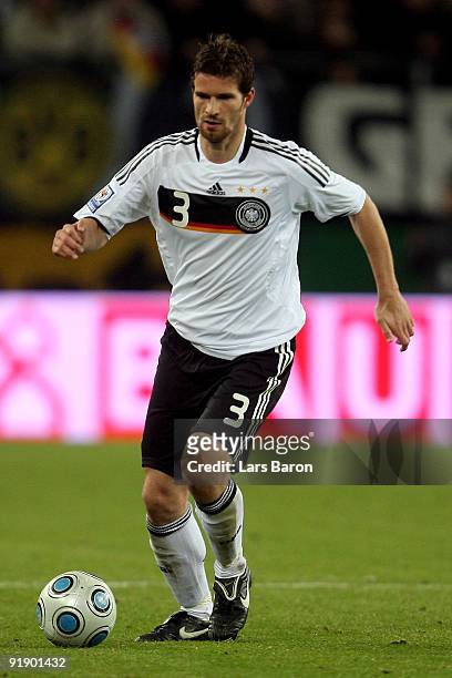 Arne Friedrich of Germany runs with the ball during the FIFA 2010 World Cup Group 4 Qualifier match between Germany and Finland at the HSH Nordbank...