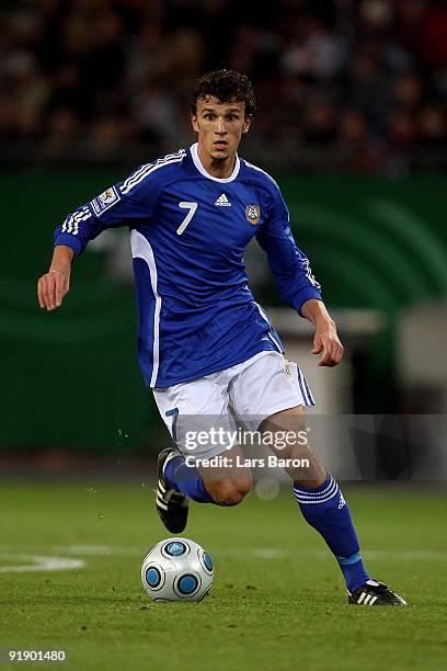 Roman Eremenko of Finland runs with the ball during the FIFA 2010 World Cup Group 4 Qualifier match between Germany and Finland at the HSH Nordbank...