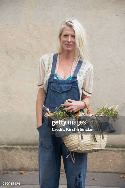 Bag designer Sarah Gray wears Vintage jumpsuit, Sarah Gray basket and Zara top day 1 of Paris Womens Fashion Week Spring/Summer 2018, on September...