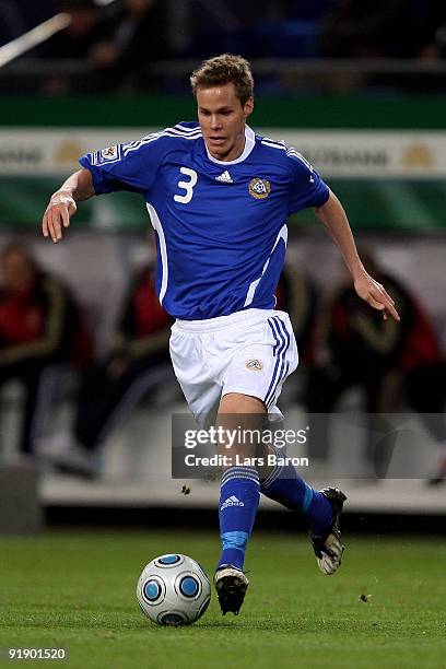 Niklas Moisander of Finland runs with the ball during the FIFA 2010 World Cup Group 4 Qualifier match between Germany and Finland at the HSH Nordbank...