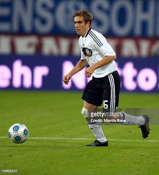 Philipp Lahm of Germany runs with the ball during the FIFA 2010 World Cup Group 4 Qualifier match between Germany and Finland at the Hamburg Arena on...